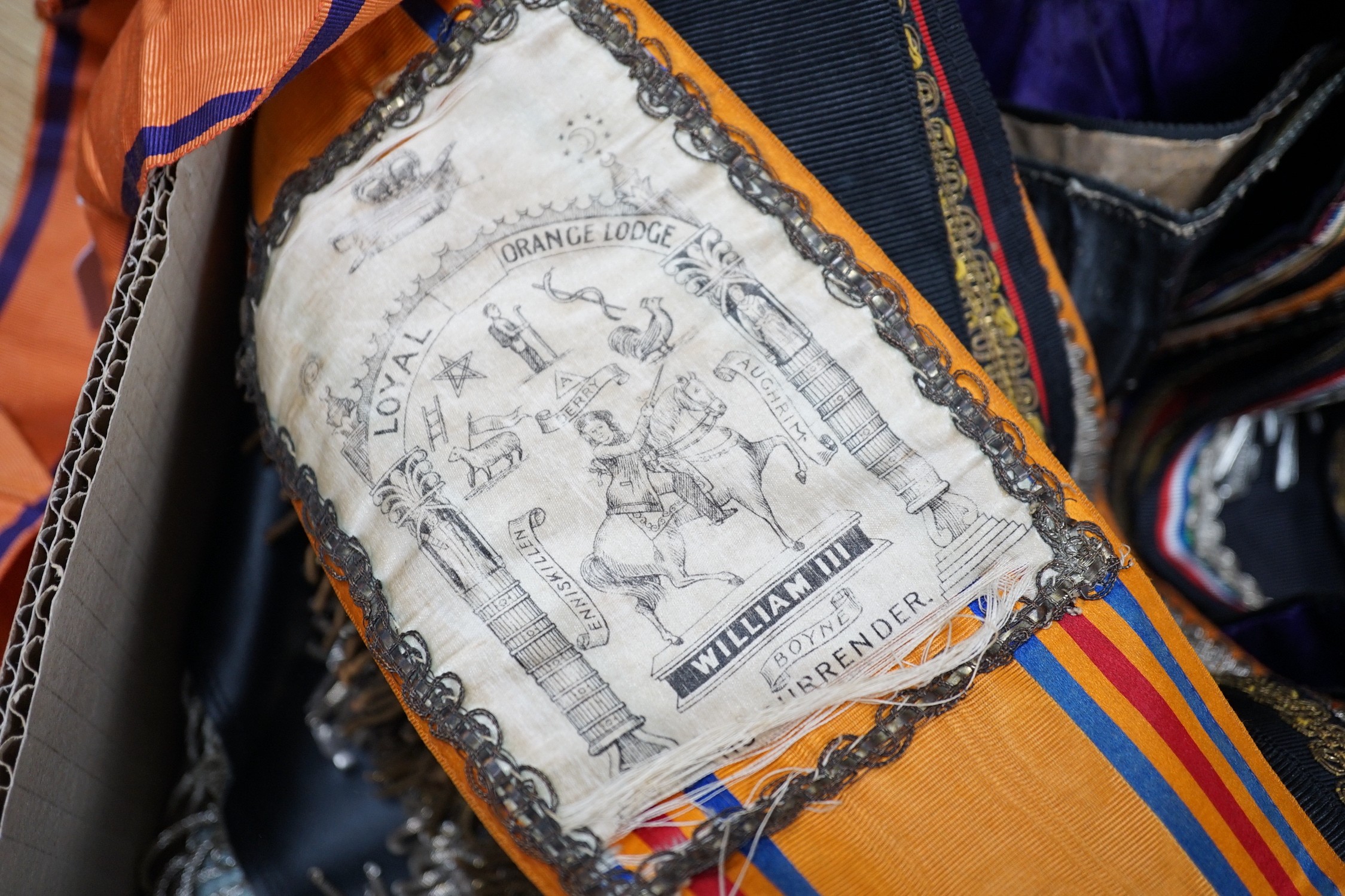 An Orange Order sash, seven Masonic sashes and two aprons